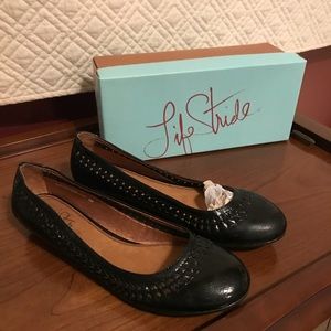 Women’s black leather shoes.